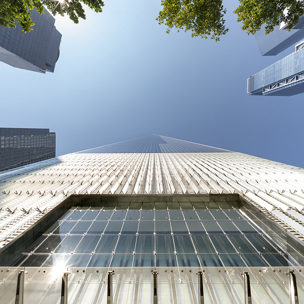 Upward View of One World Trade Center, NYC, with Blue Sky and Tops of Other Skyscrapers